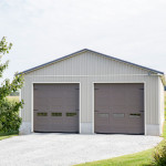 40′ x 90′ x 16′ Conventionally Frame Truck Storage Garage on 3′ Poured Concrete Wall Foundation, Metal Roof and Siding, and 2 – Painted Steel Insulated 14′ x 14′ Garage Doors.
